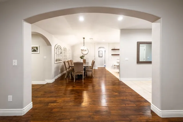 a kitchen with granite countertop stainless steel appliances a stove microwave and sink