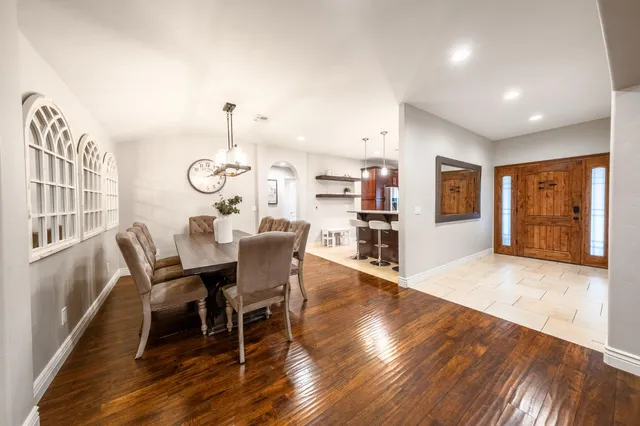 a kitchen with stainless steel appliances granite countertop a refrigerator stove and sink