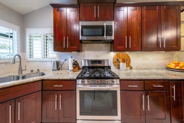 a spacious bedroom with a bed and a chandelier
