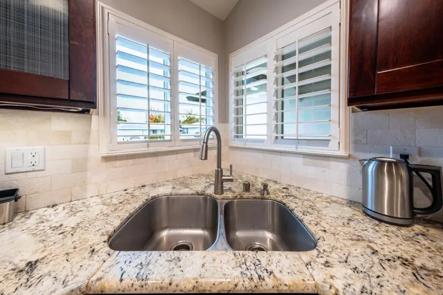 a spacious bedroom with a bed and a walk in closet