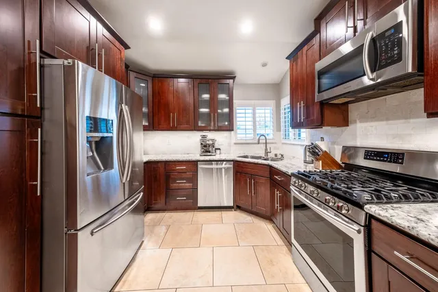 a bathroom with a sink vanity and a mirror