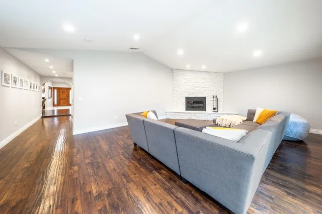 a bedroom with a bed and a large mirror