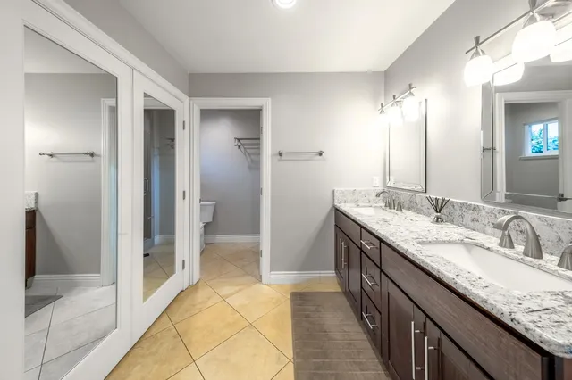 a kitchen with stainless steel appliances granite countertop a refrigerator sink and cabinets