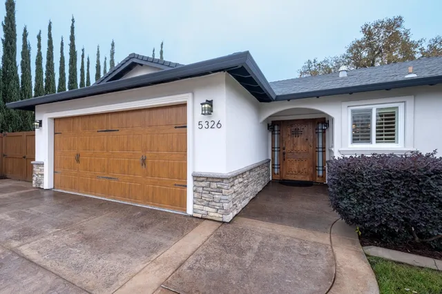 a bedroom with furniture and a wooden floor