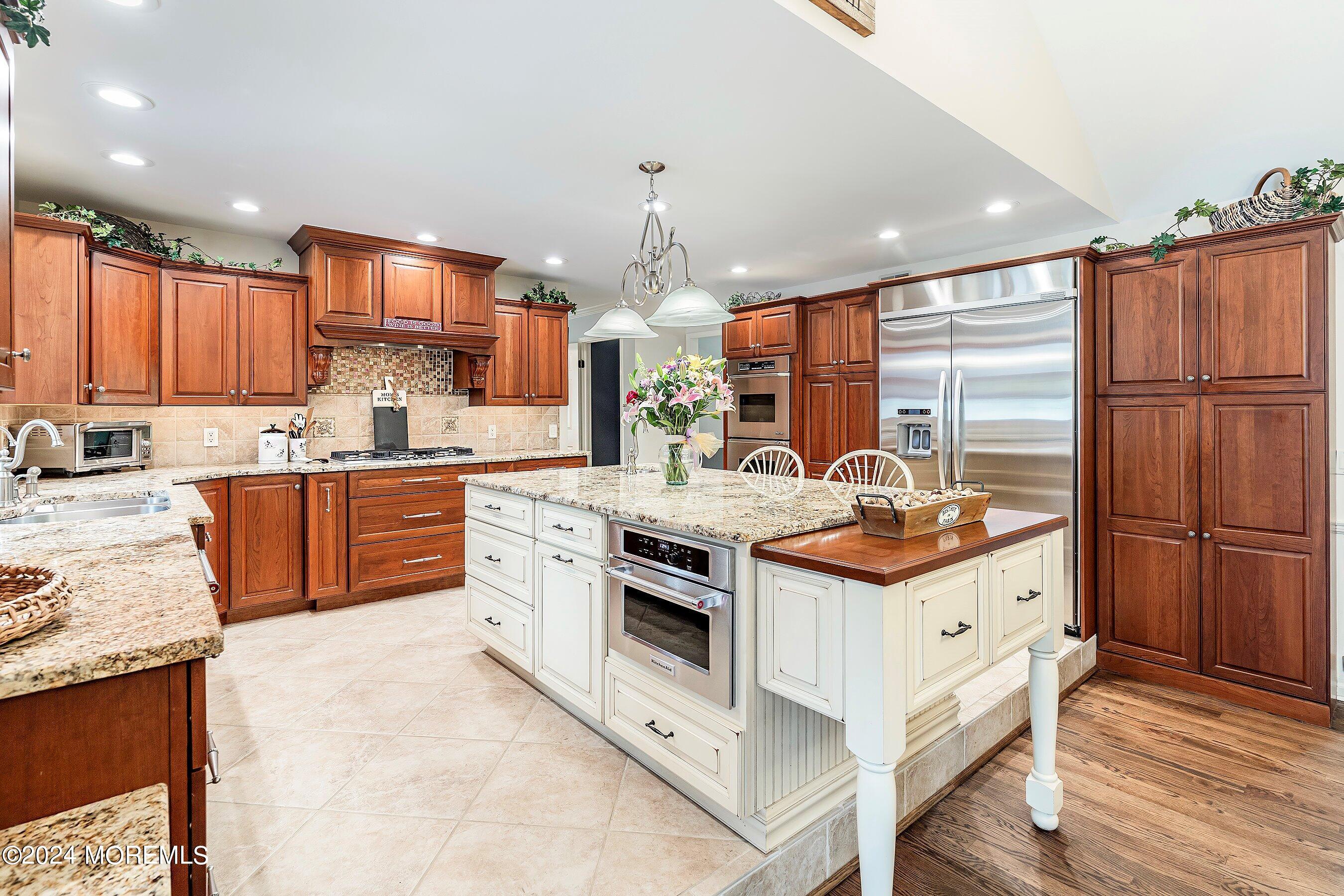 2 Pullen Drive Millstone Township, NJ 08535 - Photo 21 of 87 a kitchen with stainless steel appliances granite countertop a stove top oven a sink dishwasher and a refrigerator