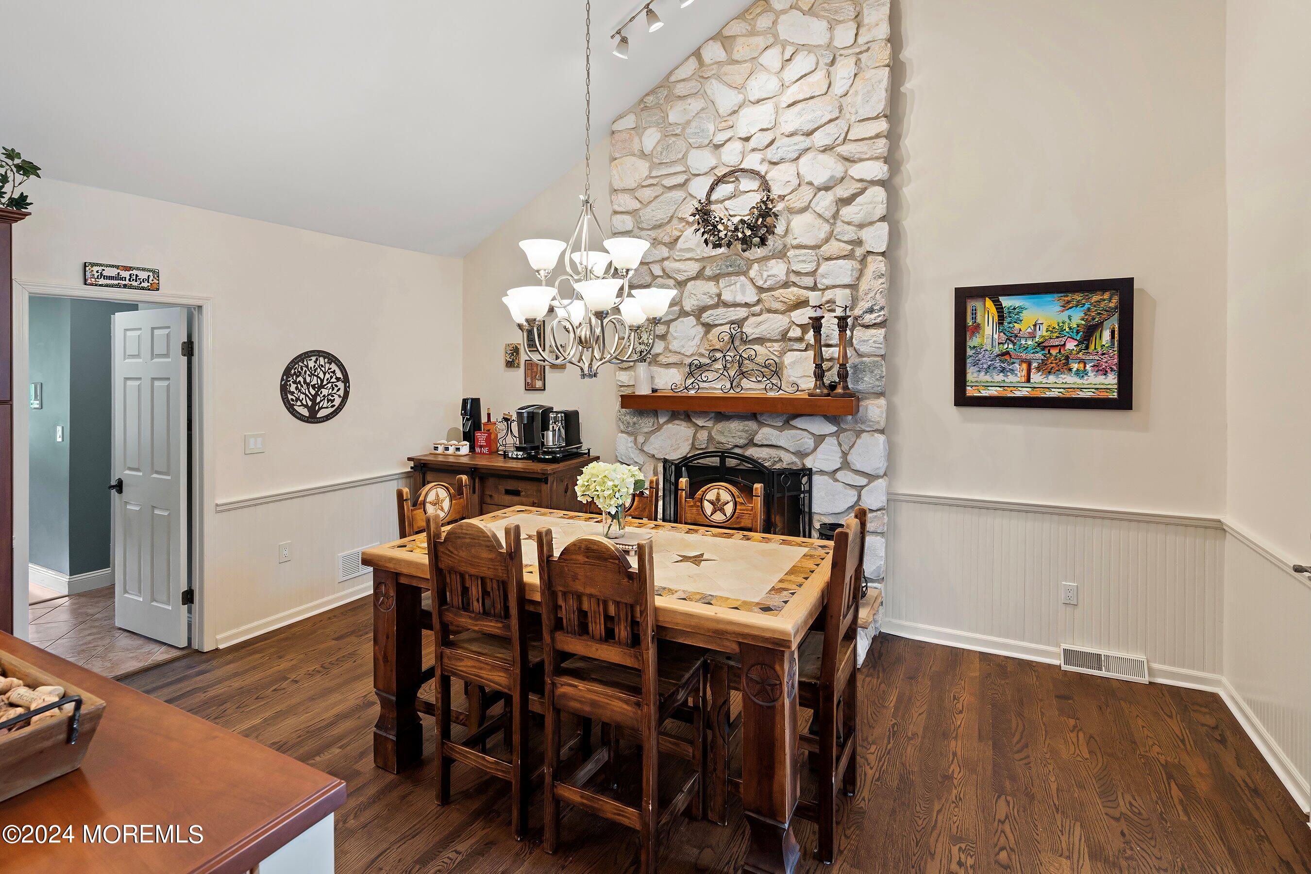 2 Pullen Drive Millstone Township, NJ 08535 - Photo 23 of 87 a view of a dining room with furniture wooden floor and chandelier