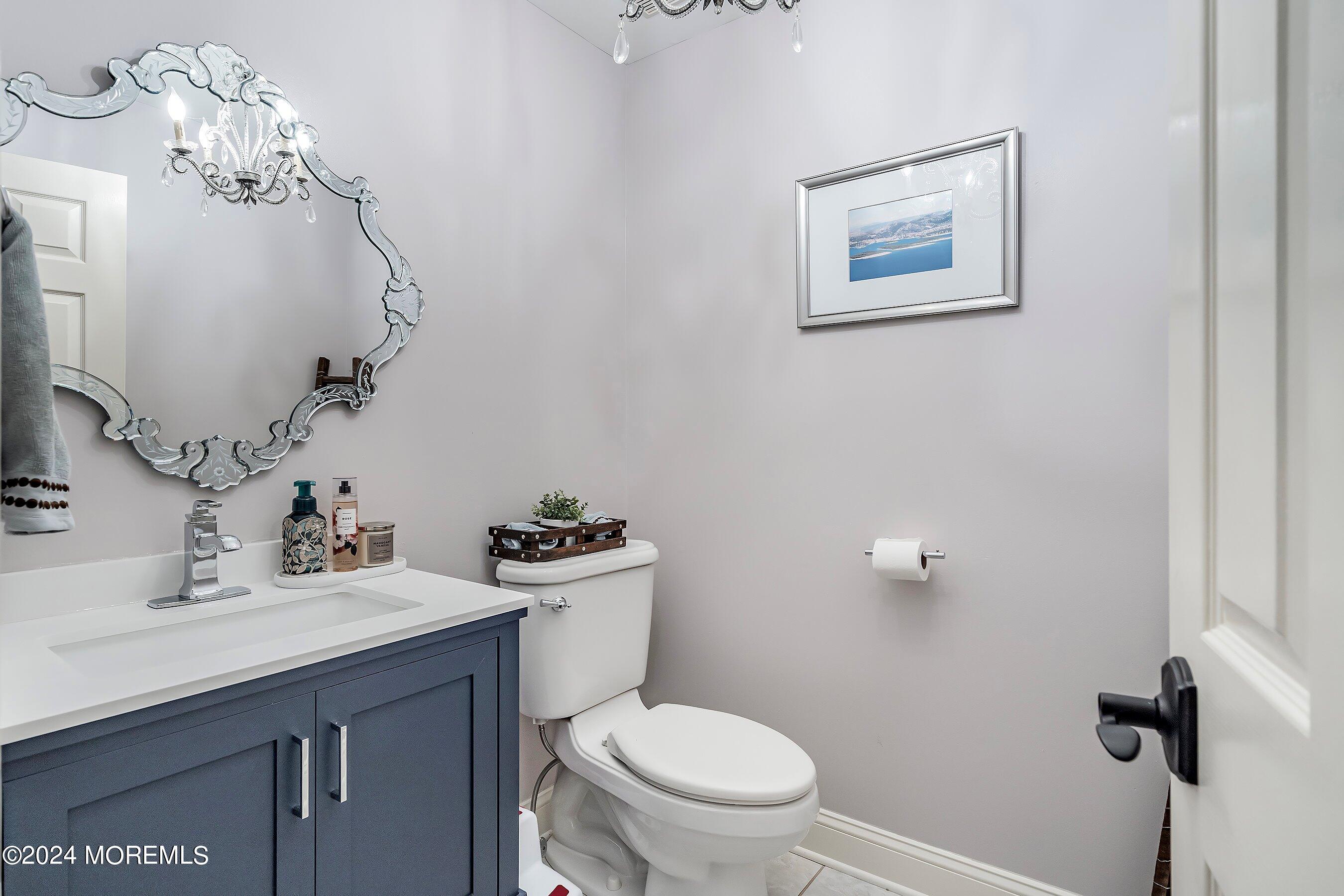 2 Pullen Drive Millstone Township, NJ 08535 - Photo 31 of 87 a bathroom with a toilet a sink and mirror