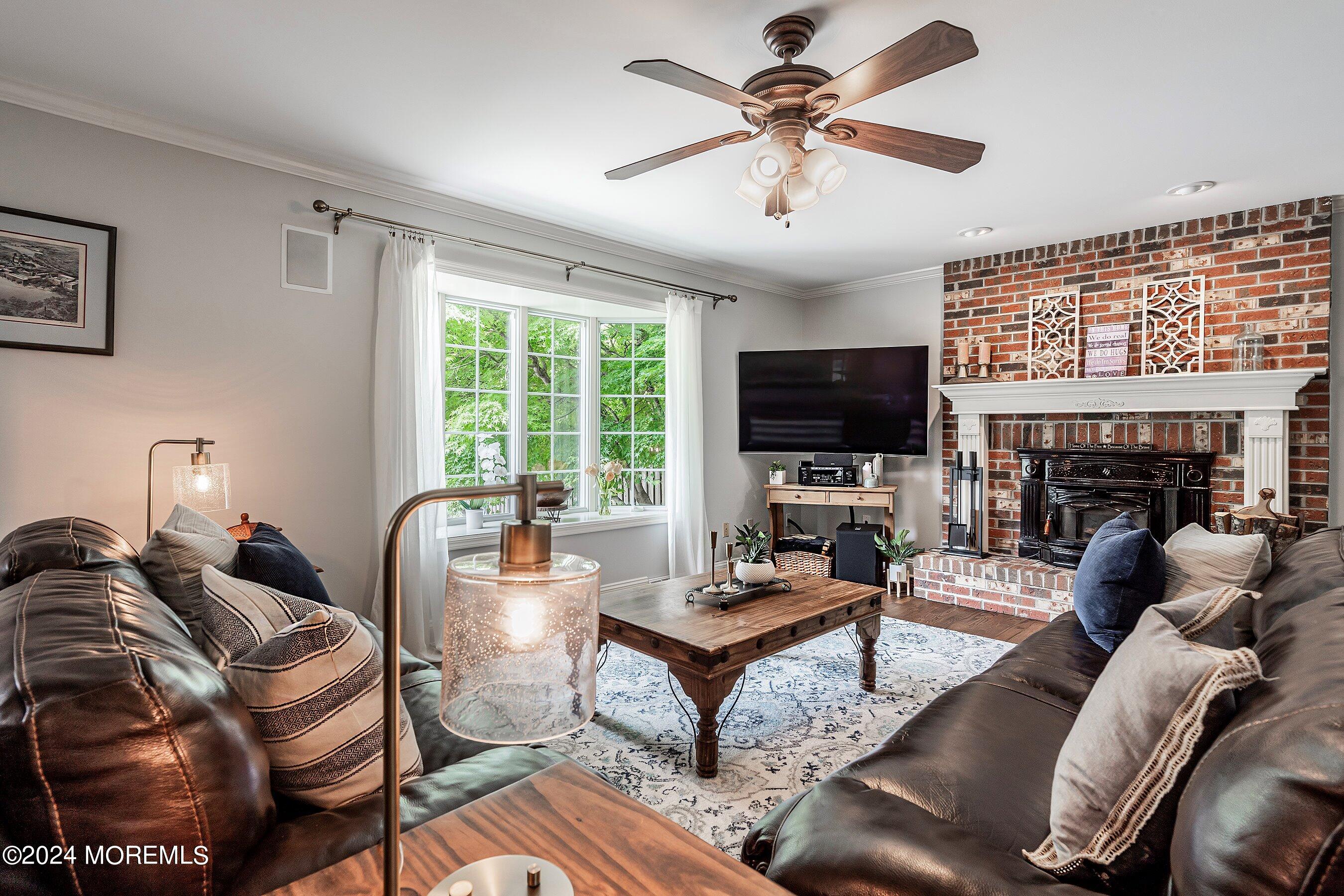 2 Pullen Drive Millstone Township, NJ 08535 - Photo 33 of 87 a living room with fireplace furniture and a flat screen tv