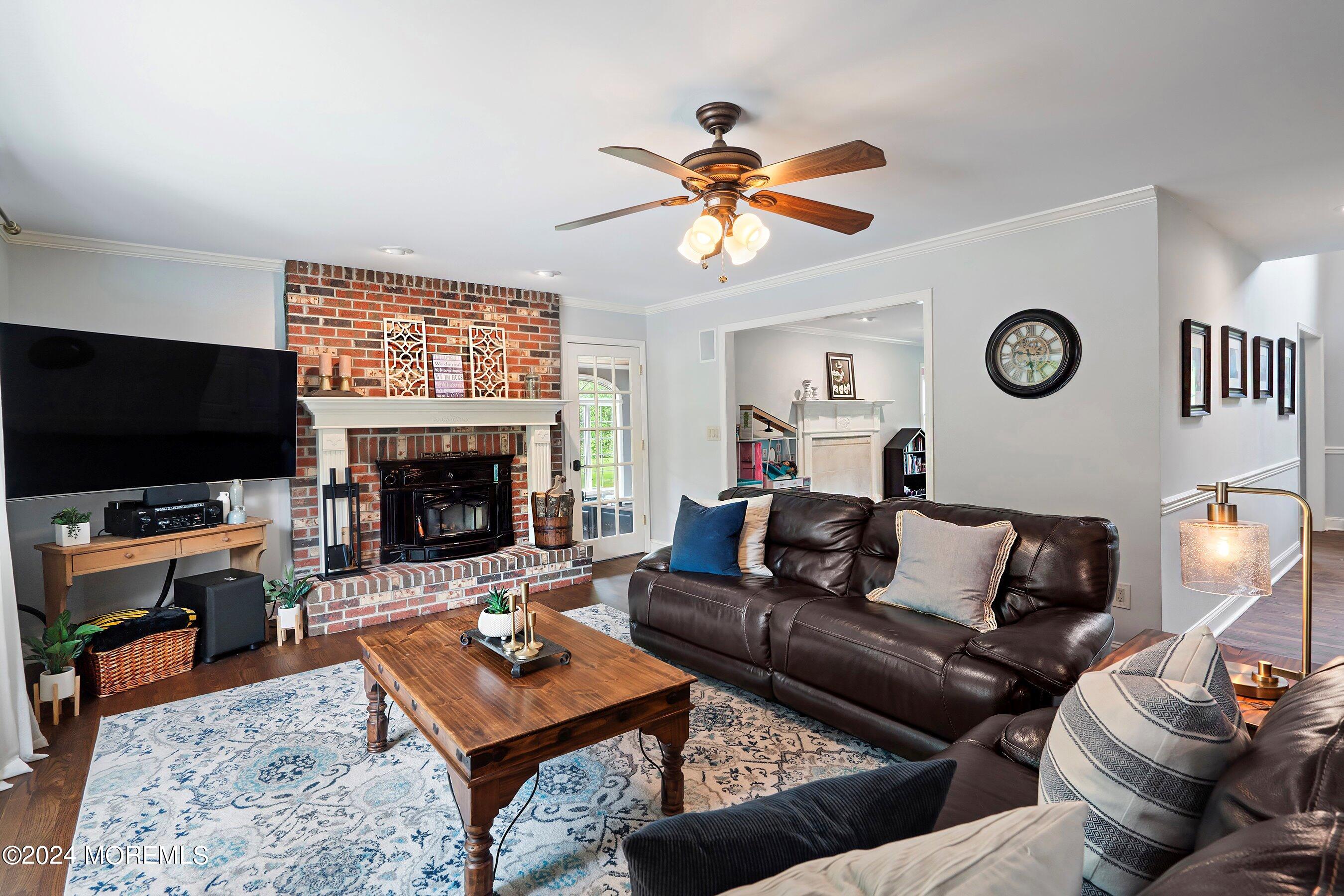 2 Pullen Drive Millstone Township, NJ 08535 - Photo 38 of 87 a living room with furniture a rug and a flat screen tv