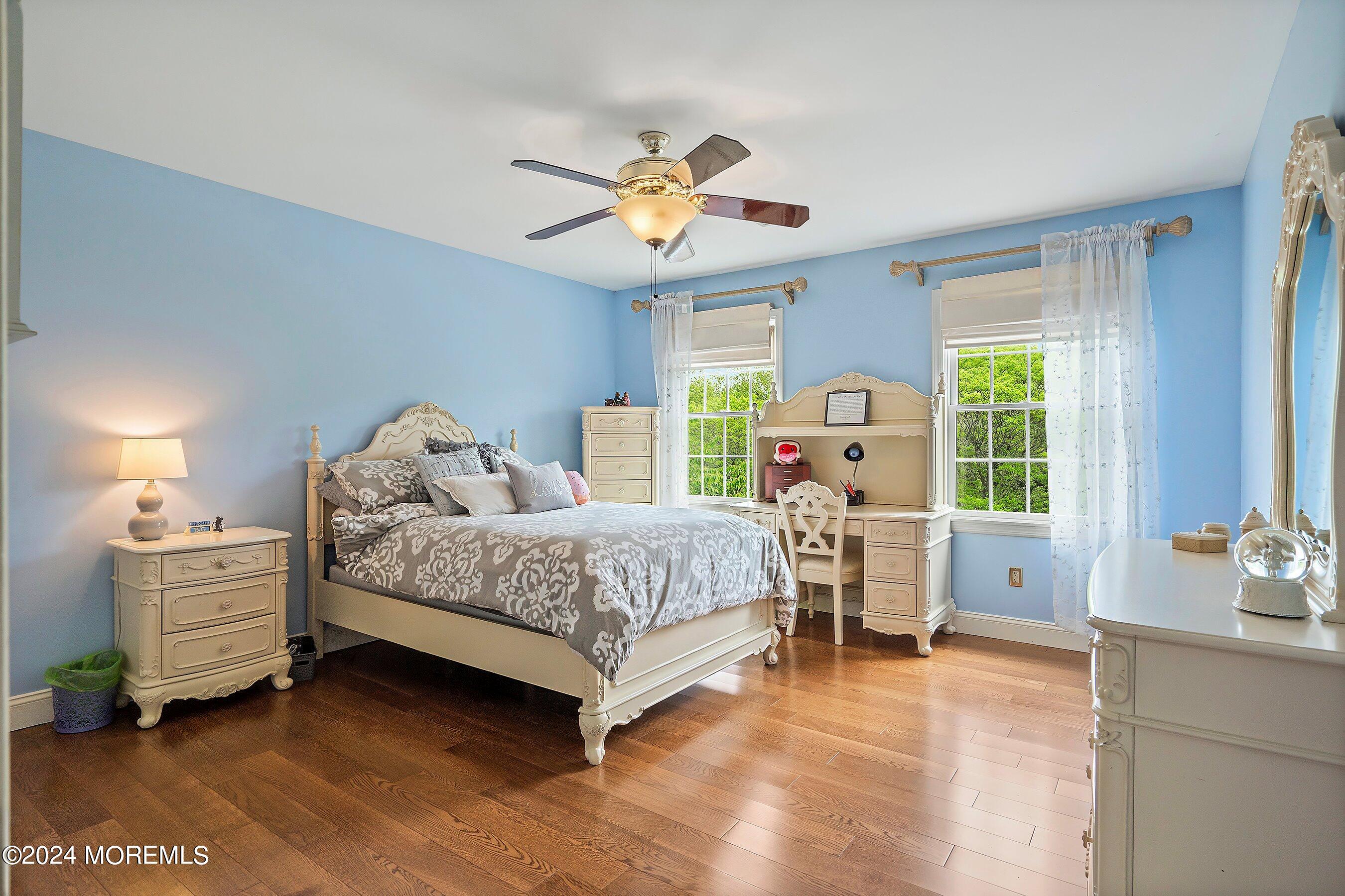 2 Pullen Drive Millstone Township, NJ 08535 - Photo 54 of 87 a bedroom with a bed and a chandelier