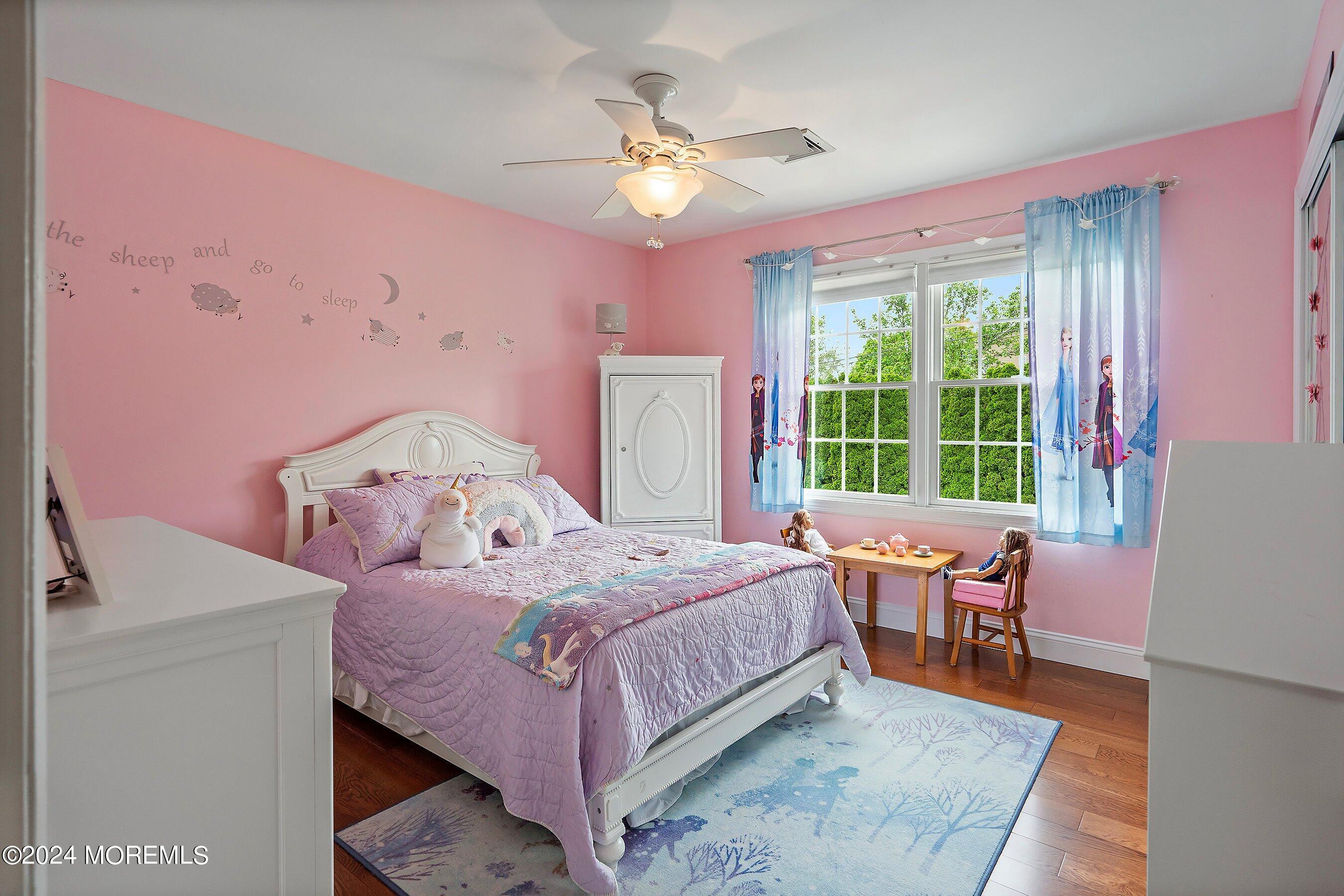 2 Pullen Drive Millstone Township, NJ 08535 - Photo 56 of 87 a bedroom with a bed and wooden floor