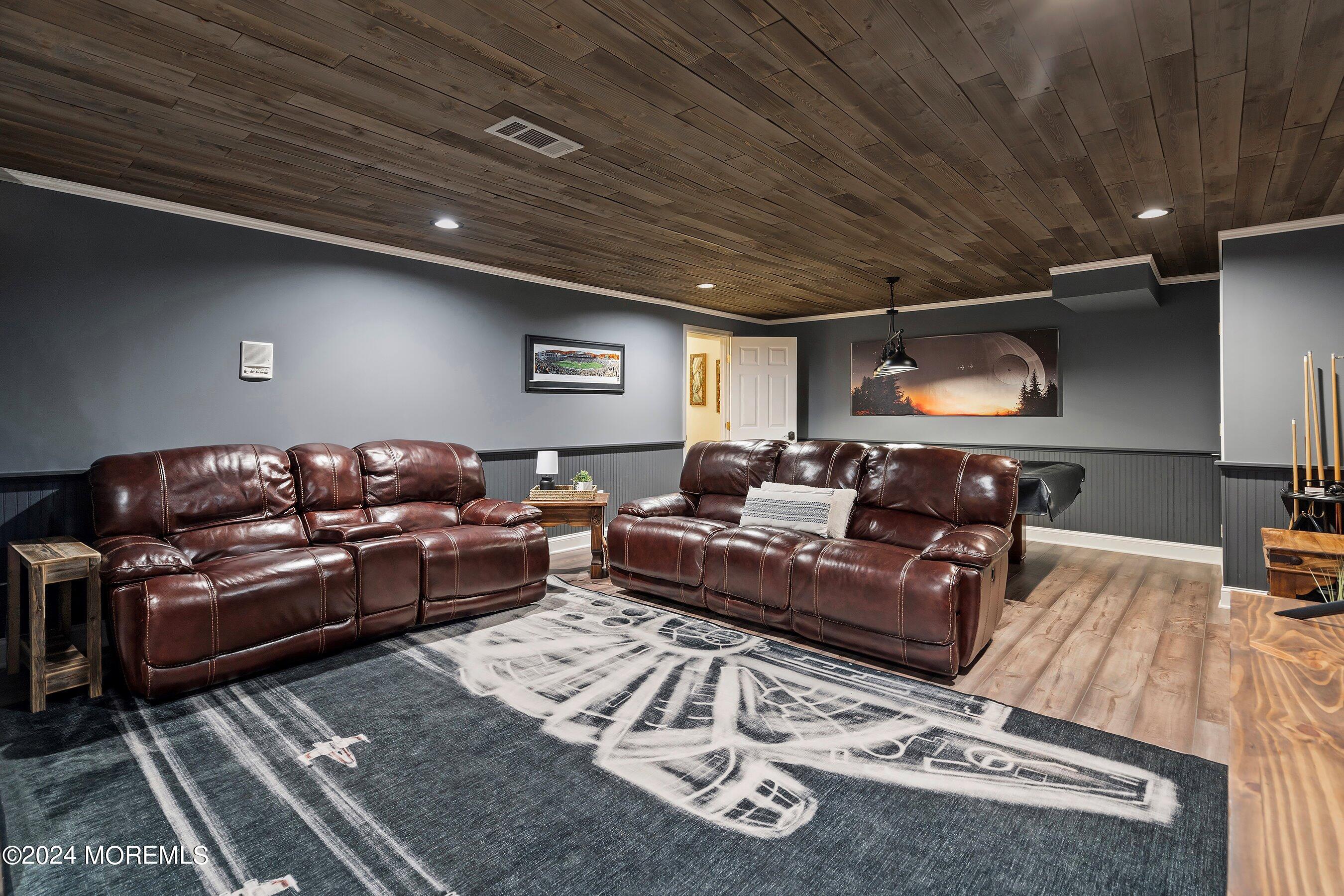 2 Pullen Drive Millstone Township, NJ 08535 - Photo 64 of 87 a living room with furniture a rug and a chandelier