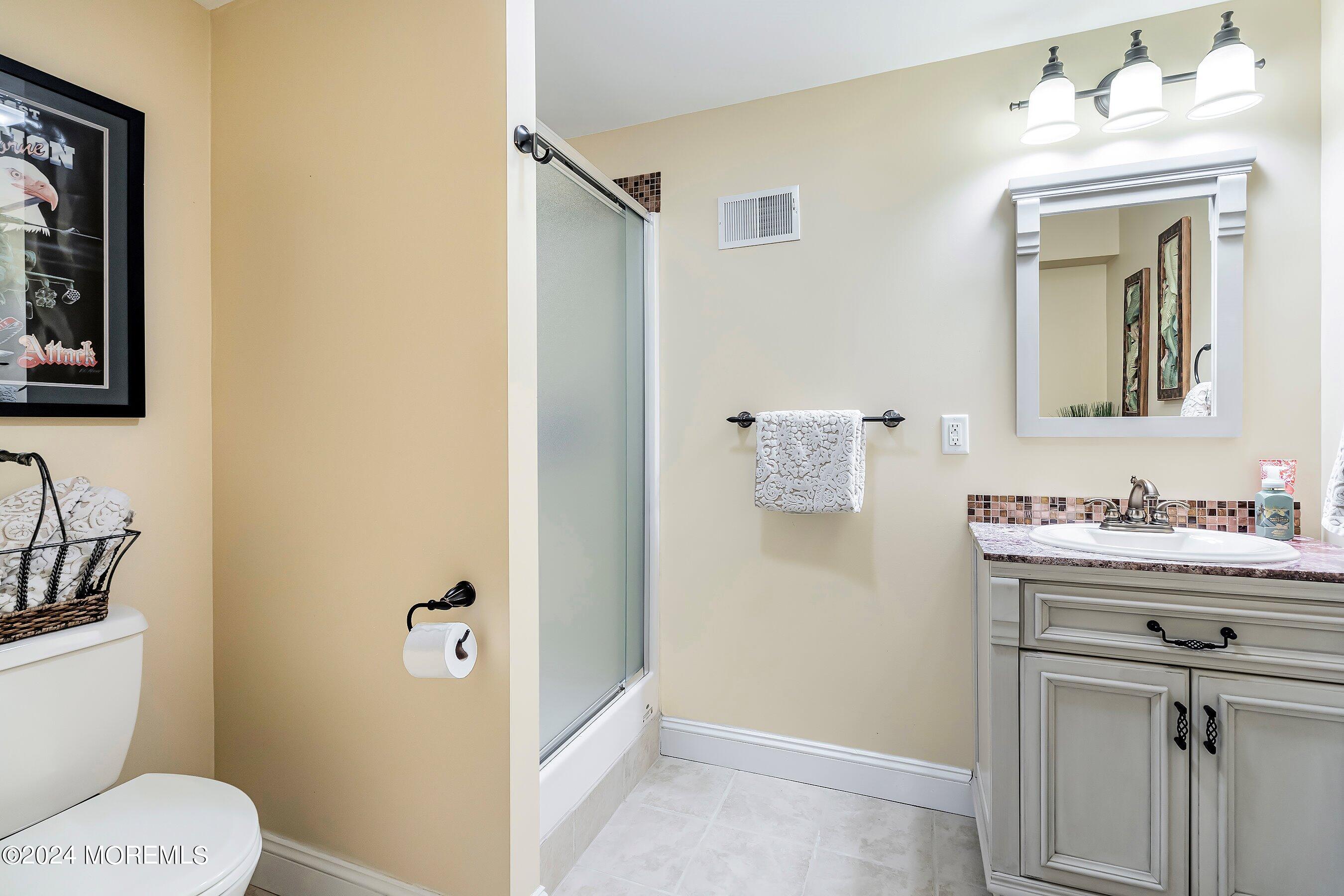 2 Pullen Drive Millstone Township, NJ 08535 - Photo 68 of 87 a bathroom with a toilet sink and mirror