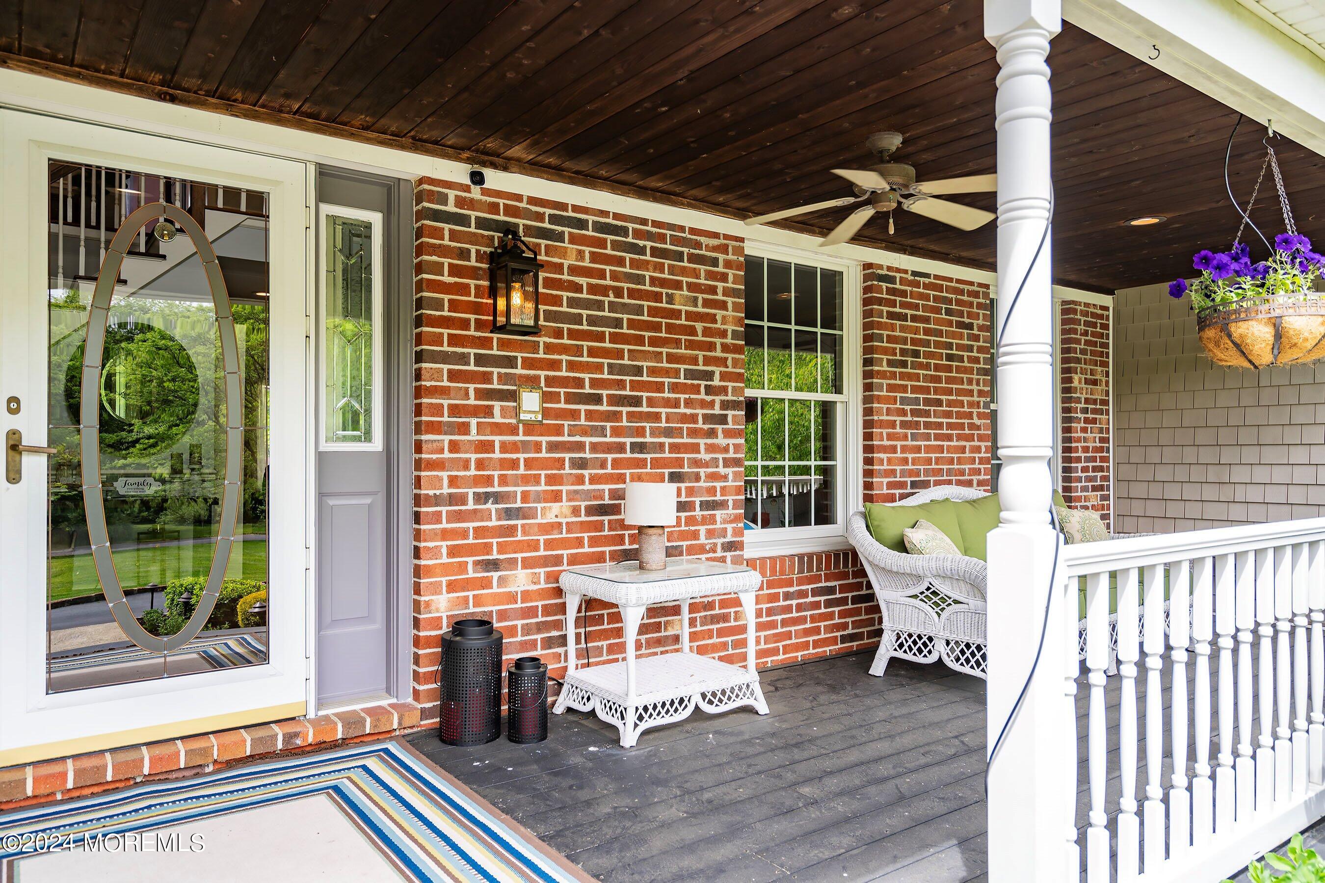 2 Pullen Drive Millstone Township, NJ 08535 - Photo 7 of 87 a view of a porch with furniture and floor to ceiling window