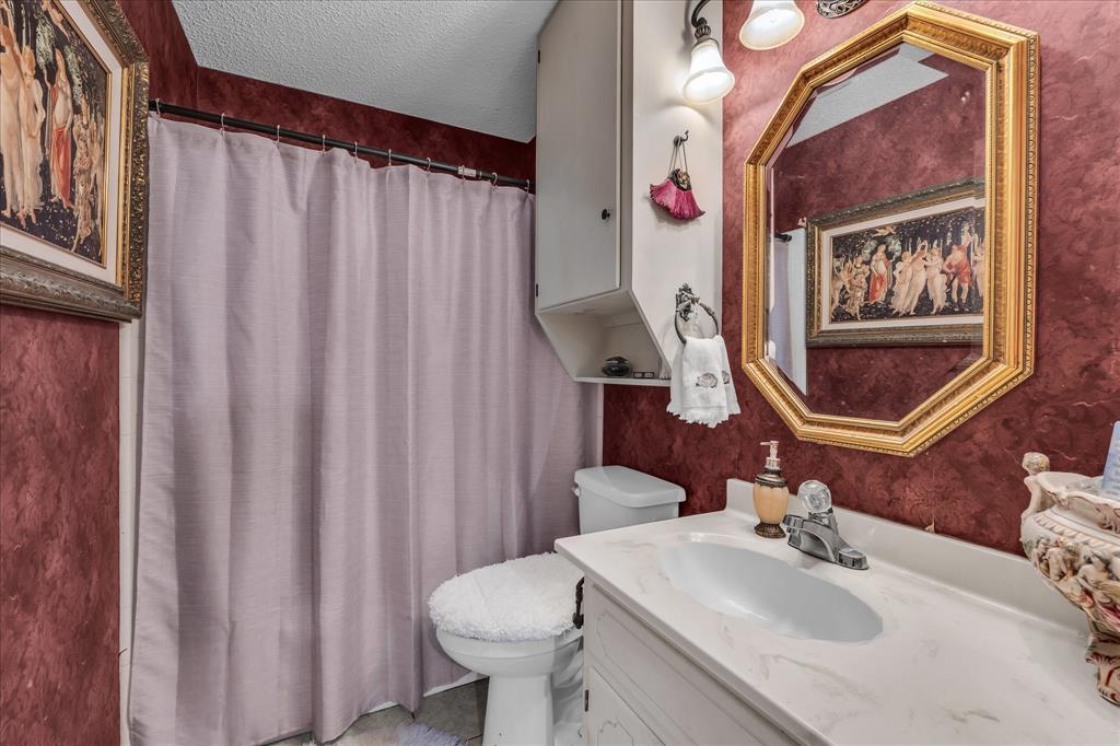 3405 Edna Avenue Waco, TX 76708 - Photo 14 of 29 a bathroom with a sink toilet and mirror