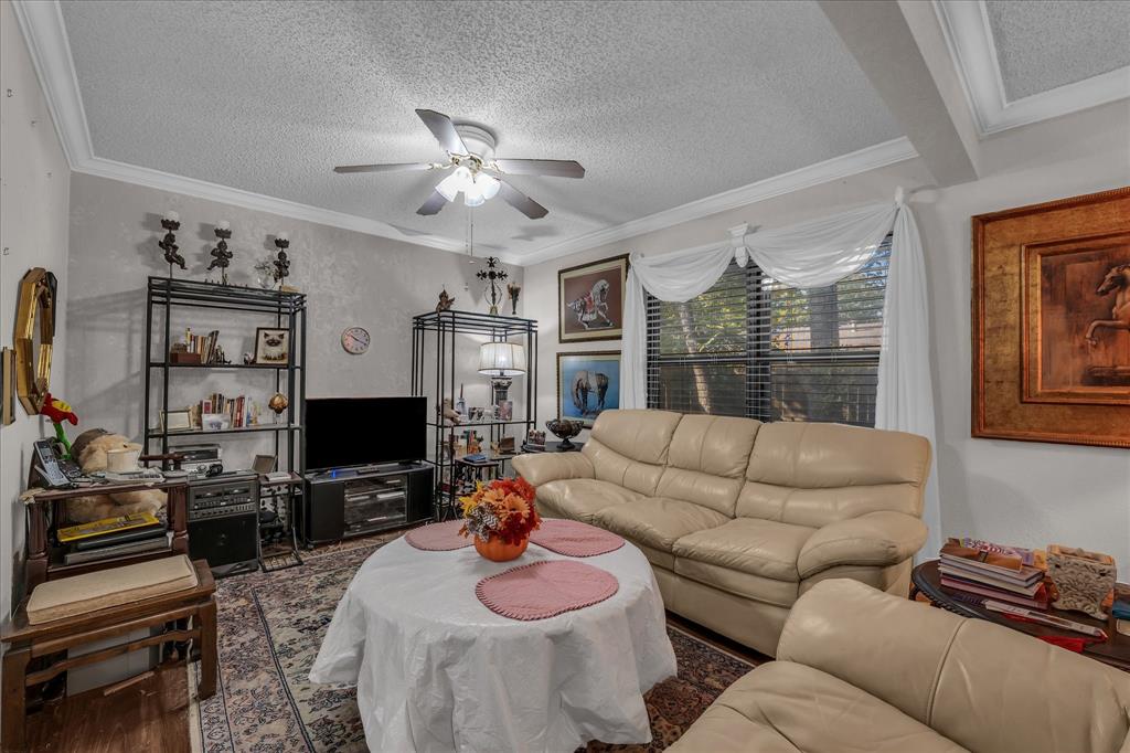 3405 Edna Avenue Waco, TX 76708 - Photo 5 of 29 a living room with furniture a flat screen tv and a large window