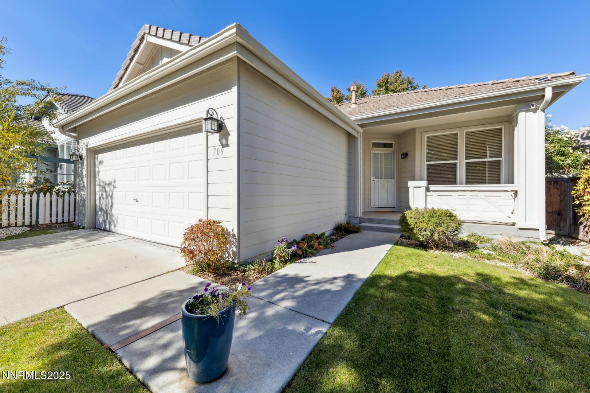 709 Caughlin Glen Reno, NV 89519 - Photo 1 of 41 a front view of a house with a garden