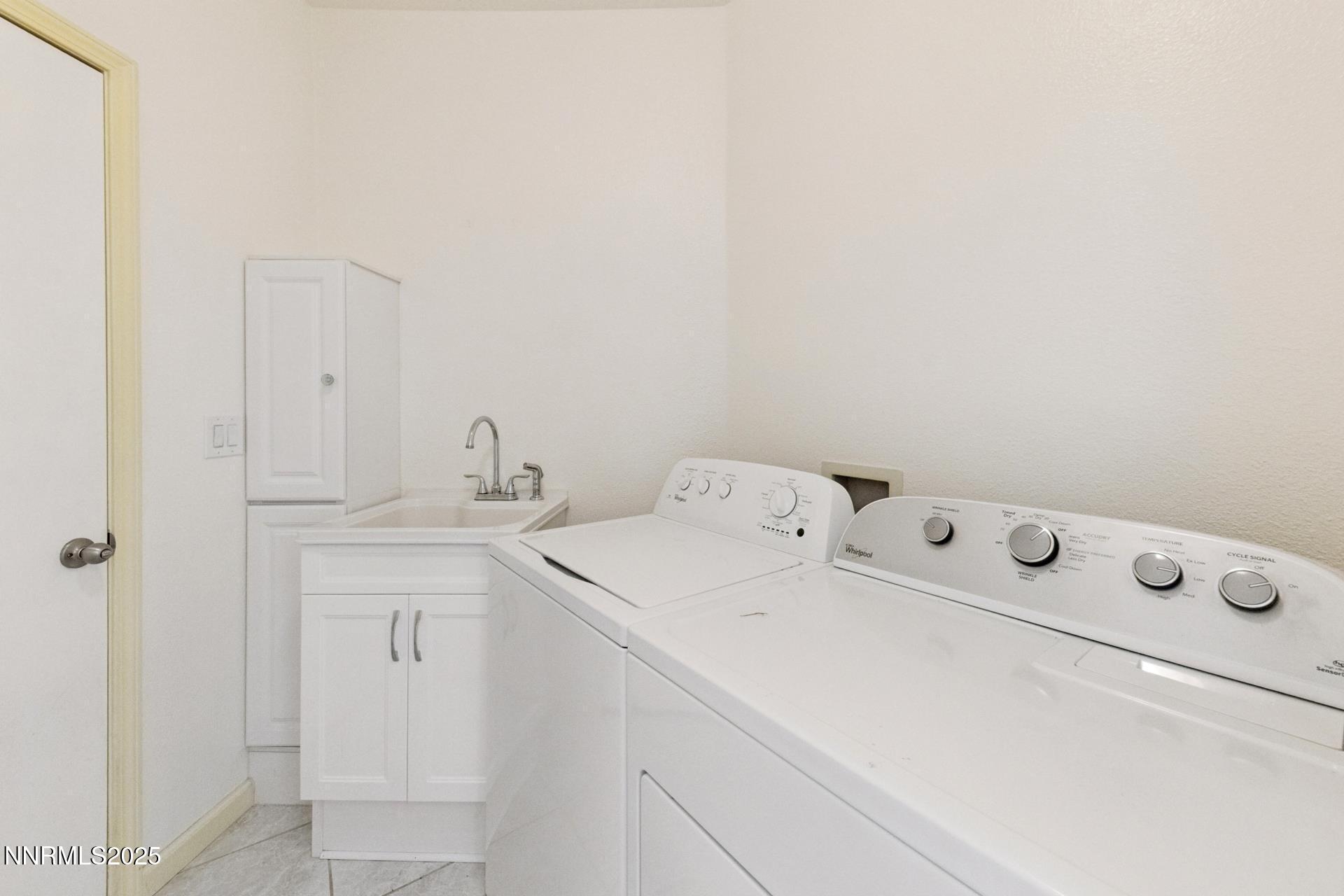 709 Caughlin Glen Reno, NV 89519 - Photo 14 of 41 a utility room with dryer and washer
