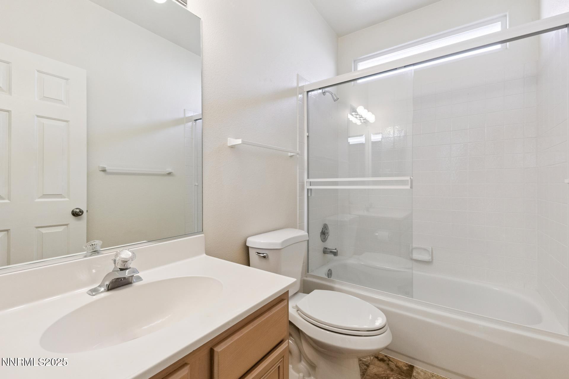 709 Caughlin Glen Reno, NV 89519 - Photo 18 of 41 a bathroom with a sink a toilet and a mirror