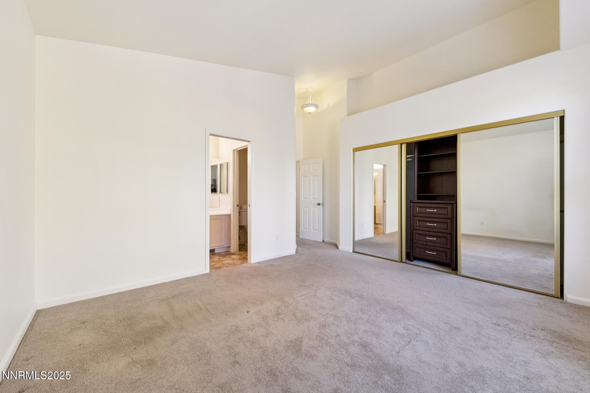 709 Caughlin Glen Reno, NV 89519 - Photo 21 of 41 an empty room with closet and a bathroom