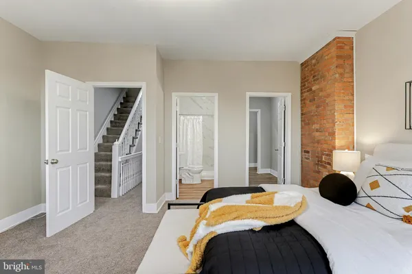 a bedroom with furniture and a bed