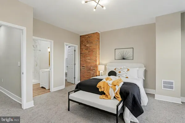 a bedroom with furniture and a couch