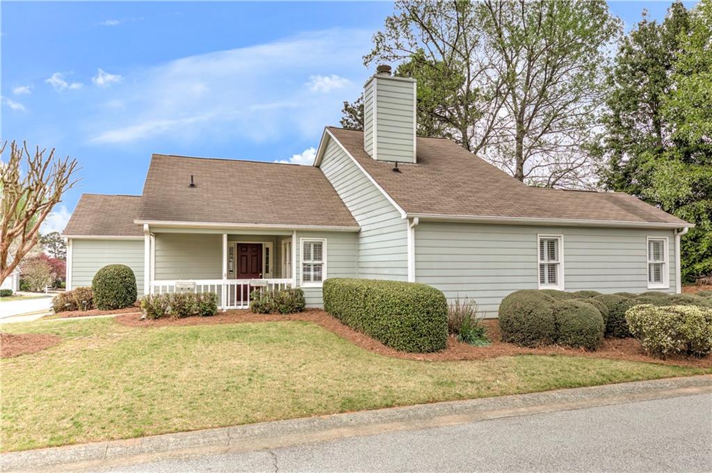 94 Robyn Way Marietta, GA 30062 - Photo 5 of 40 a front view of a house with garden