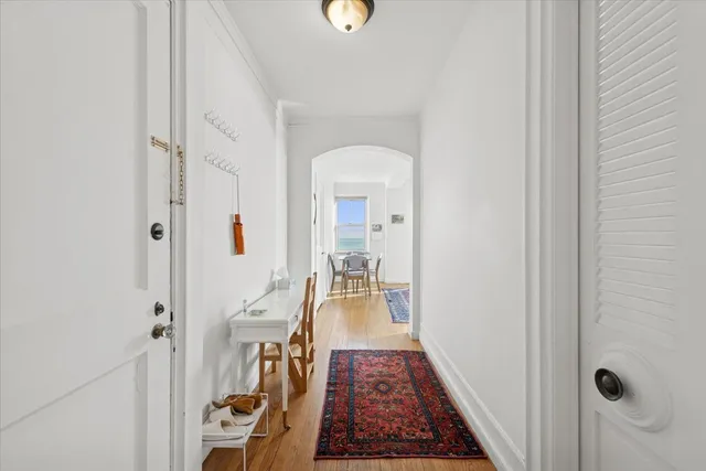 a living room with furniture rug and window