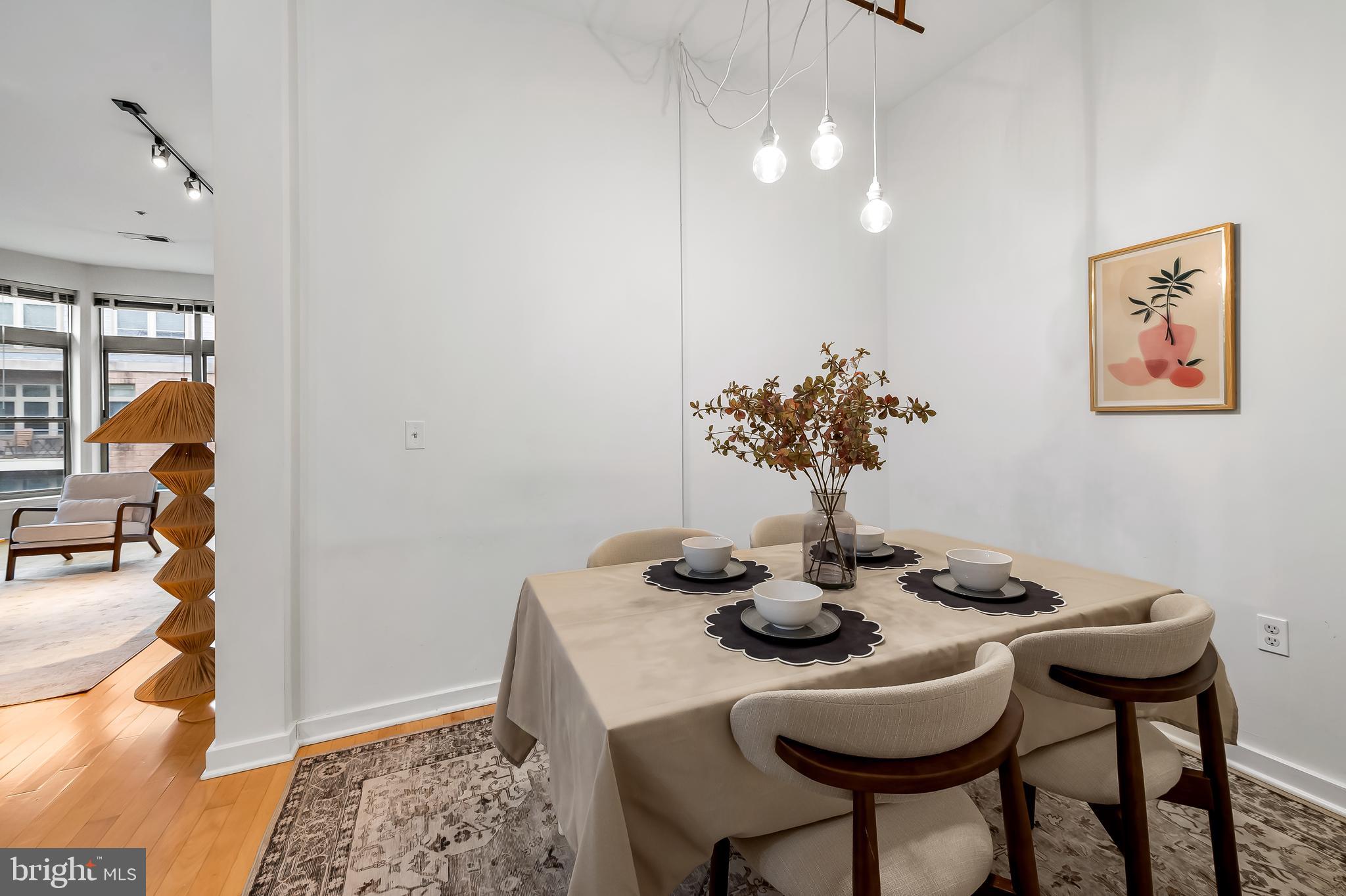 1209 North Charles Street, Unit 314 Baltimore, MD 21201 - Photo 17 of 34 a dining room with furniture and wooden floor