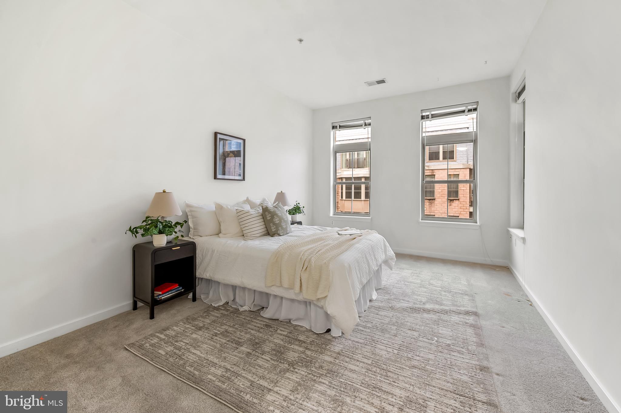 1209 North Charles Street, Unit 314 Baltimore, MD 21201 - Photo 21 of 34 a bed room with a bed and a window