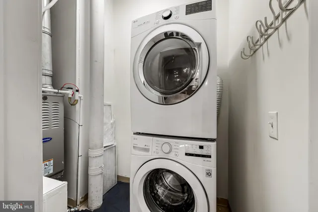 a view of a hallway with washer and dryer