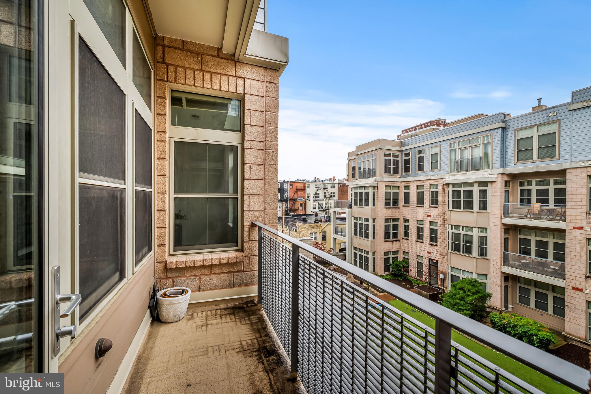 1209 North Charles Street, Unit 314 Baltimore, MD 21201 - Photo 30 of 34 a view of a building from a balcony