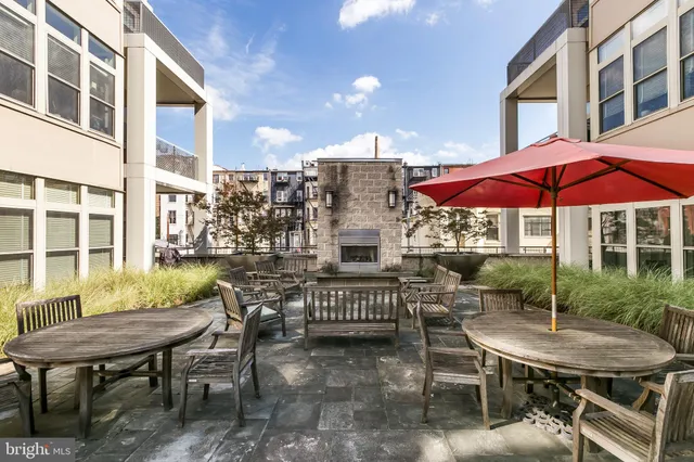 a balcony with table and chairs
