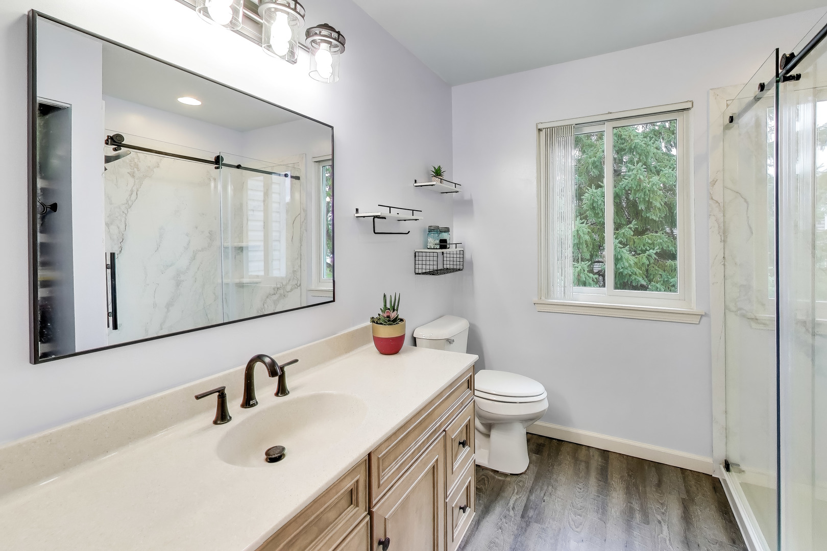 470 Country Place Lindenhurst, IL 60046 - Photo 14 of 29 a bathroom with a sink mirror toilet and next to a window
