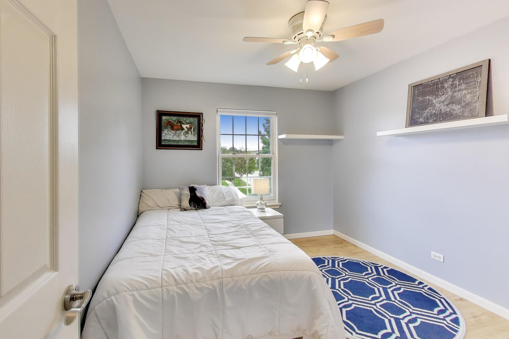470 Country Place Lindenhurst, IL 60046 - Photo 16 of 29 a bedroom with a large bed and a window