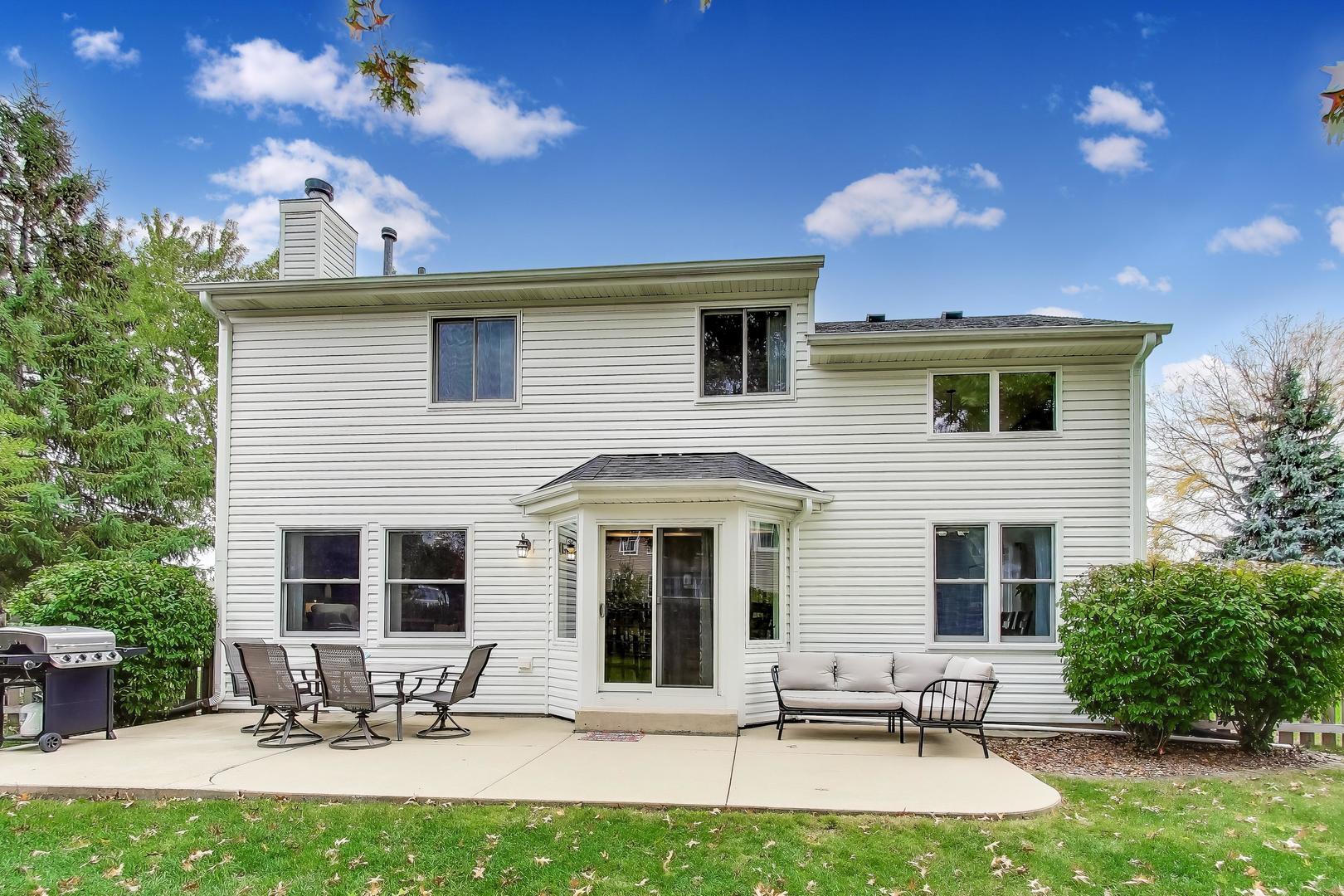 470 Country Place Lindenhurst, IL 60046 - Photo 21 of 29 a view of a patio with table and chairs with a yard