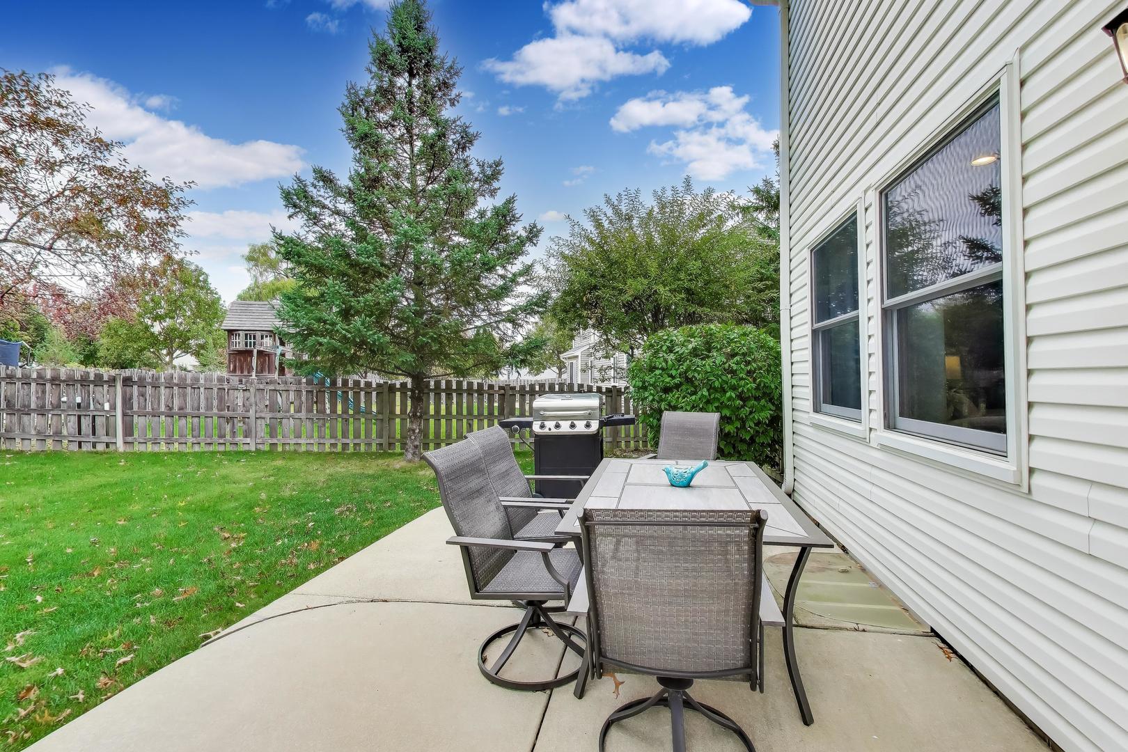 470 Country Place Lindenhurst, IL 60046 - Photo 22 of 29 a view of a patio with a table chairs and backyard