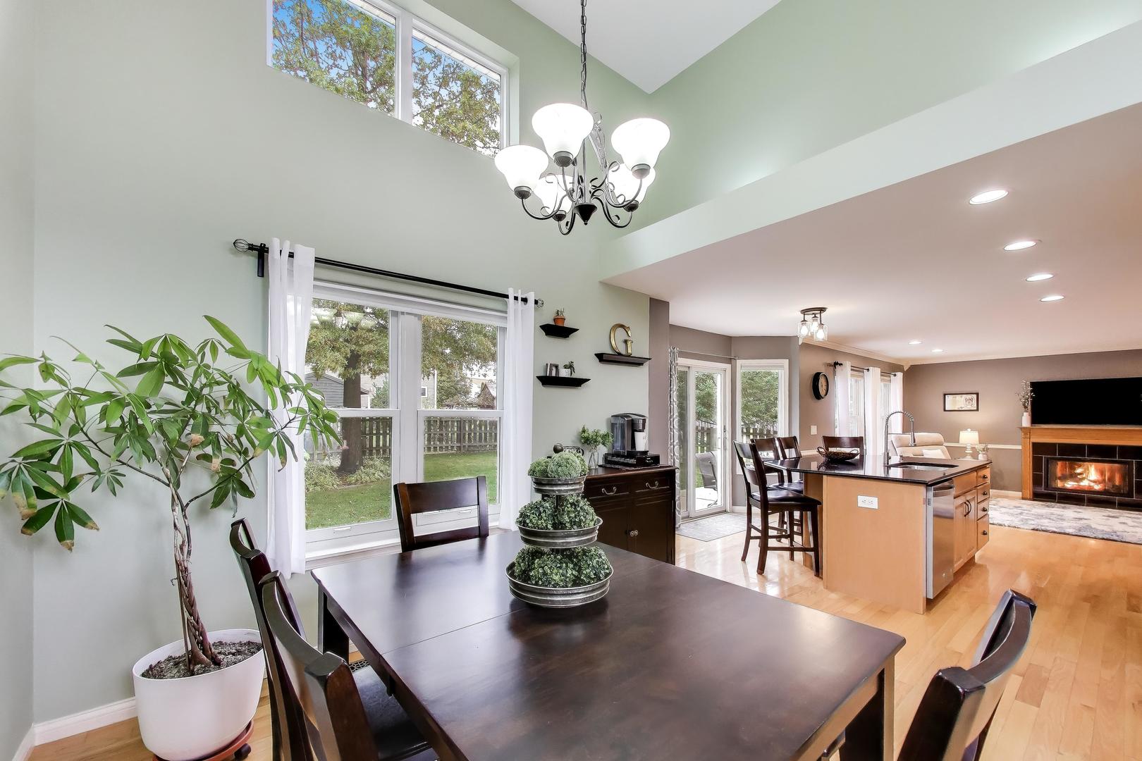470 Country Place Lindenhurst, IL 60046 - Photo 7 of 29 a view of a dining room with furniture a livingroom and chandelier
