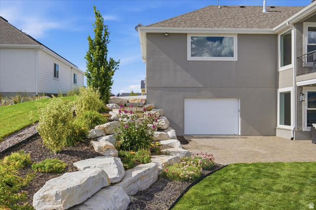 21 Pier Place Tooele, UT 84074 - Photo 88 of 112 Terraced landscaping with substantial rock formations and diverse plantings