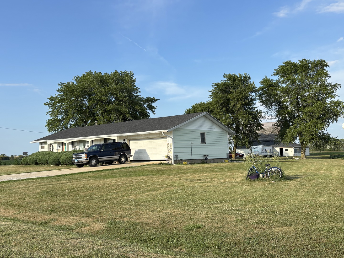 1736 North 600 East Road Gilman, IL 60938 - Photo 2 of 7 a view of swimming pool with lawn chairs and large trees