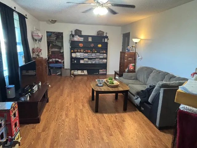 a living room with furniture and a flat screen tv