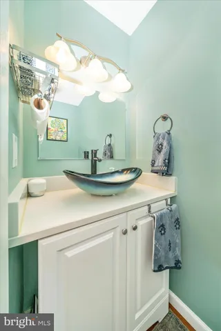 a bathroom with a sink and mirror
