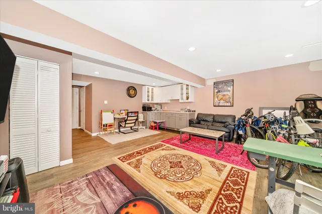 a bed room with furniture and wooden floor
