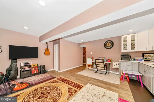 a bedroom with furniture and a flat screen tv