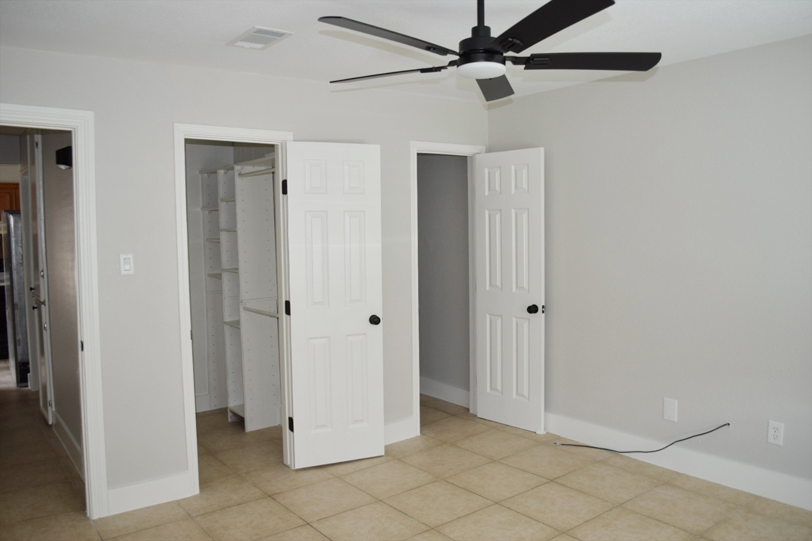 2324 Peppermill Road Houston, TX 77080 - Photo 14 of 20 Primary bedroom with view of the half bath and walk in closet.