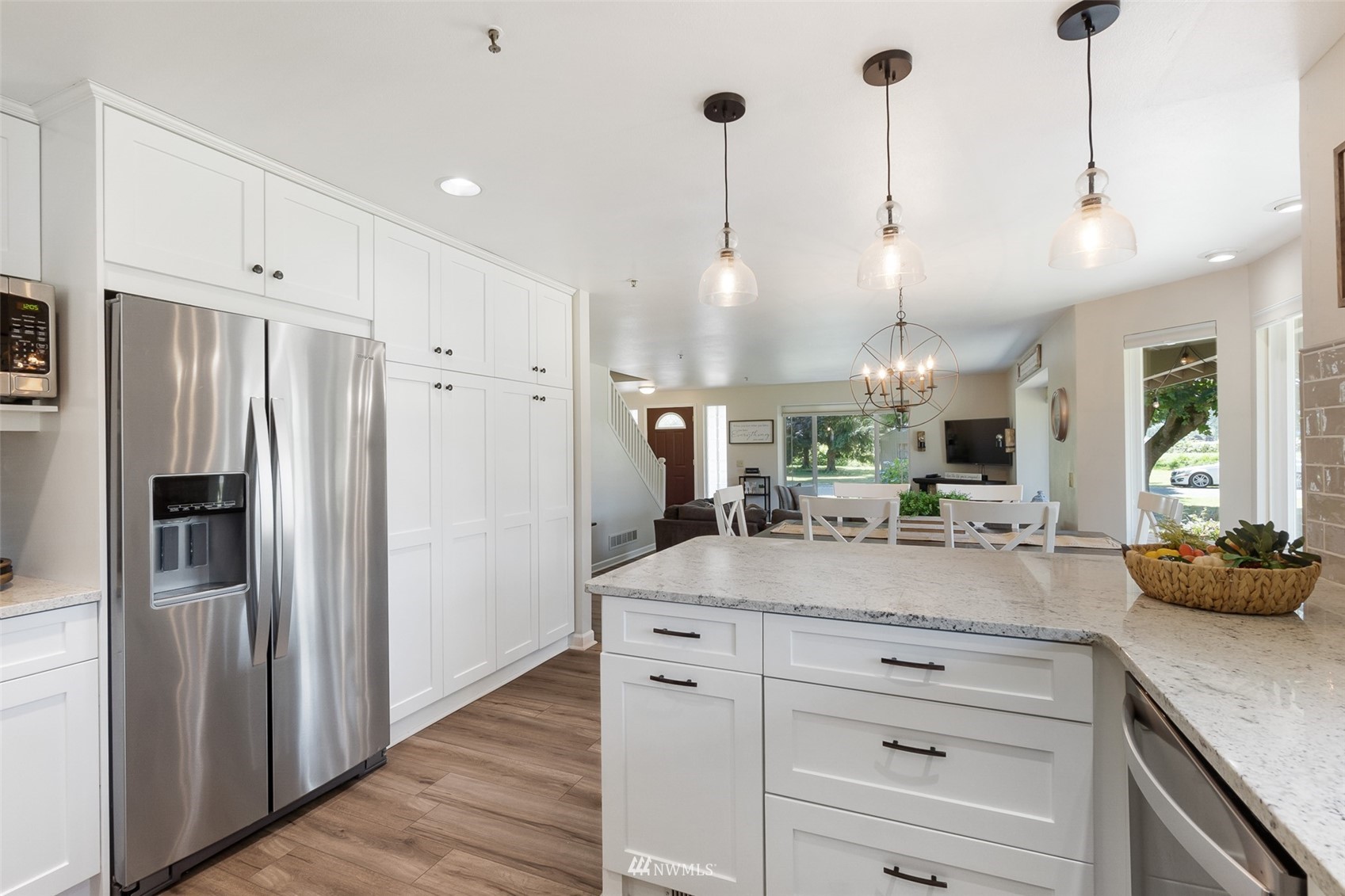 21847 Frager Road South Kent, WA 98032 - Photo 14 of 34 a view of a kitchen with kitchen island a counter top space stainless steel appliances and a counter top space