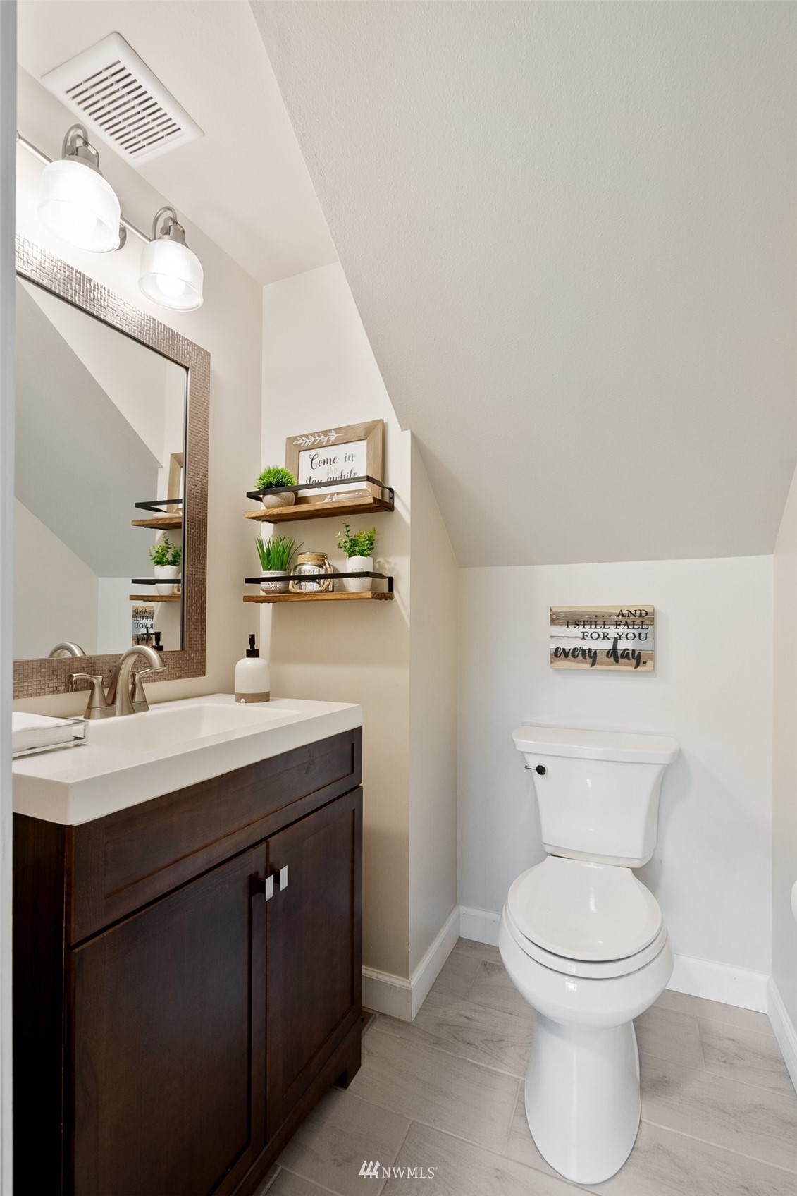 21847 Frager Road South Kent, WA 98032 - Photo 19 of 34 a bathroom with a toilet a sink and mirror