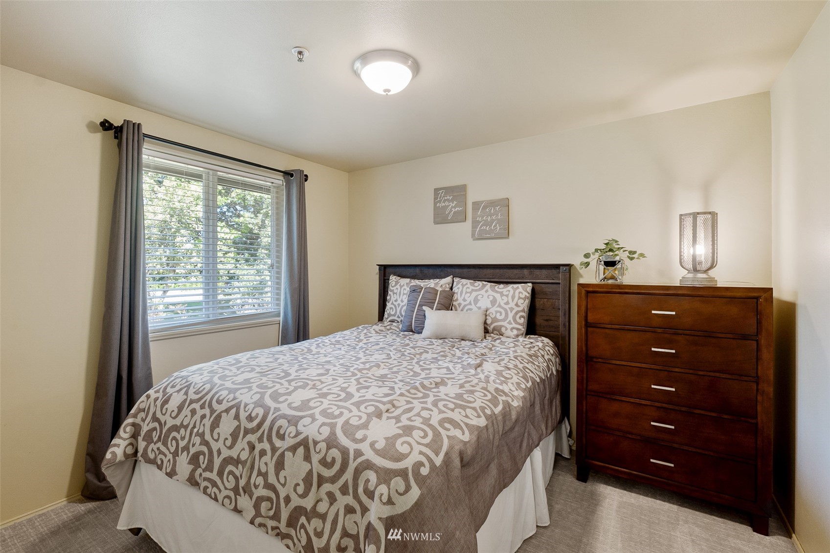 21847 Frager Road South Kent, WA 98032 - Photo 20 of 34 a bedroom with a bed and a window