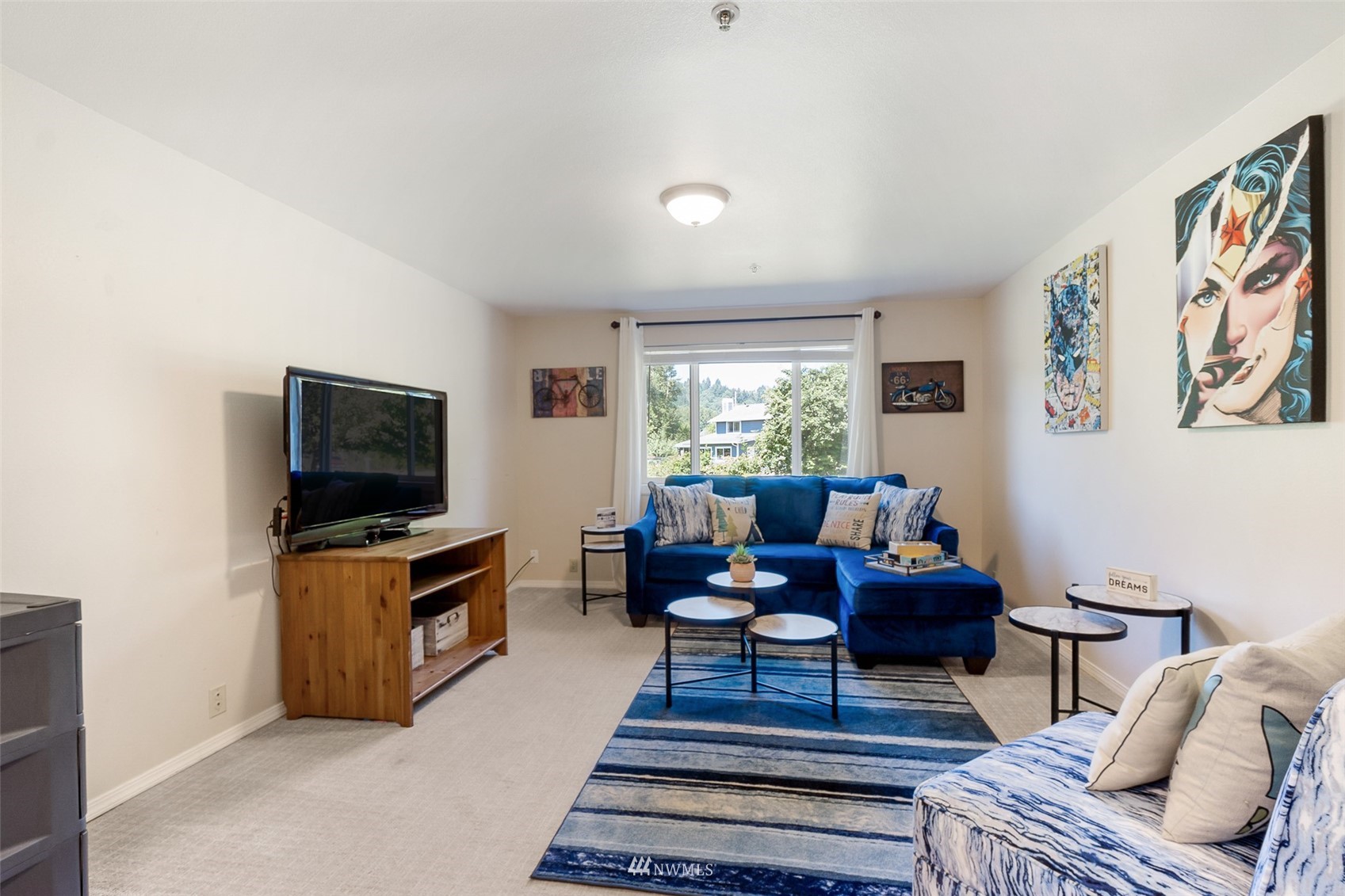 21847 Frager Road South Kent, WA 98032 - Photo 21 of 34 a living room with furniture and a flat screen tv
