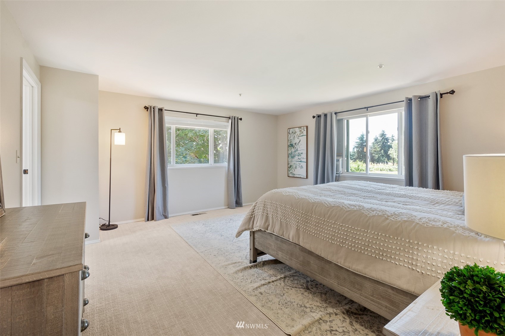 21847 Frager Road South Kent, WA 98032 - Photo 25 of 34 a large bed sitting in a bedroom next to a window